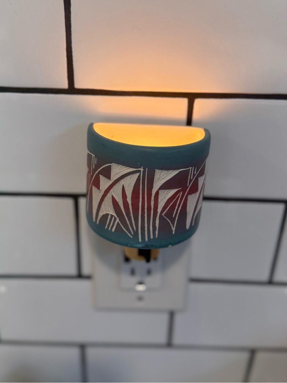 Southwestern-style carved ceramic night light. Turquoise and Mauve